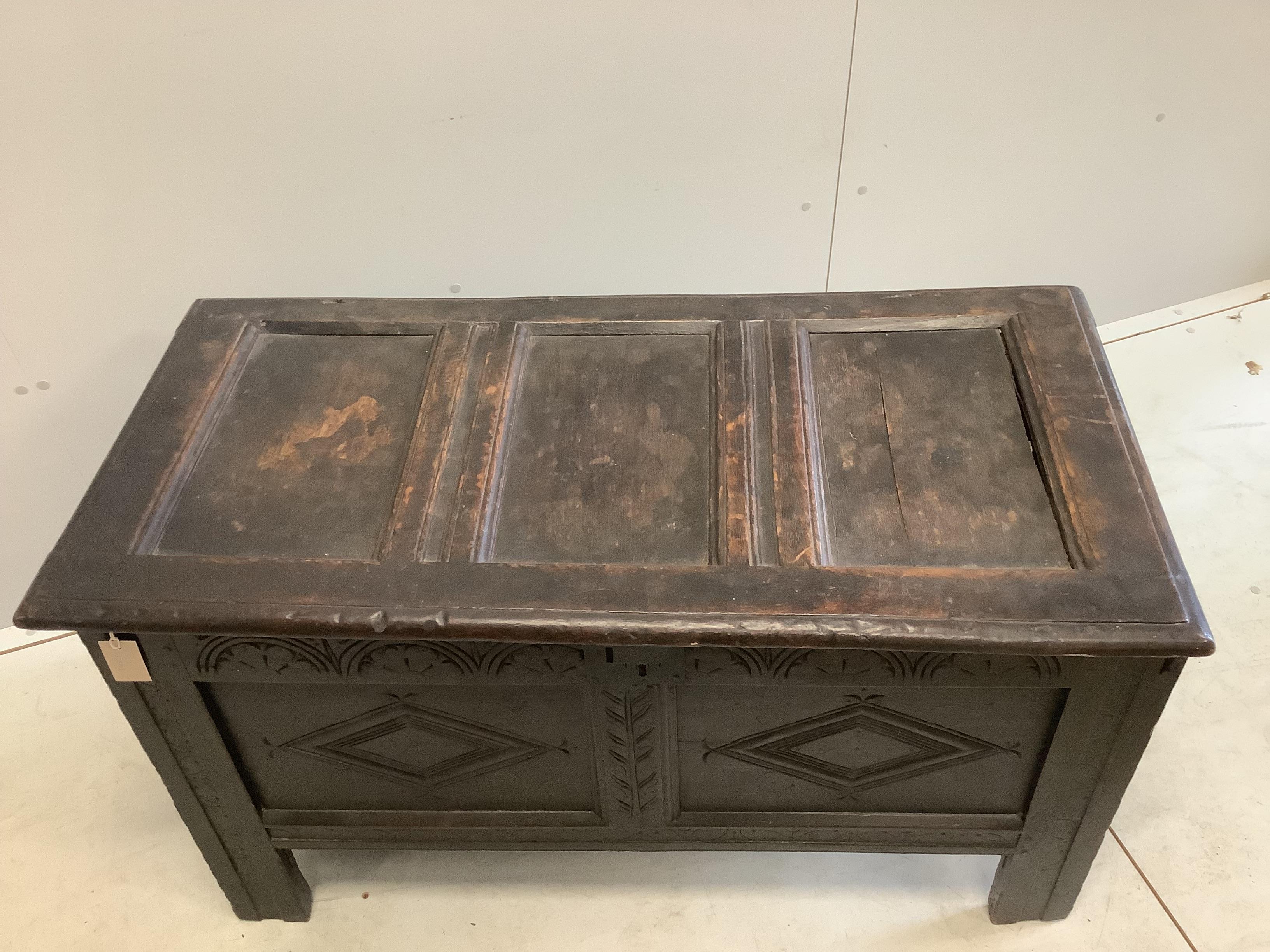 A 17th century oak coffer carved with initials A and C, width 110cm, depth 51cm, height 63cm